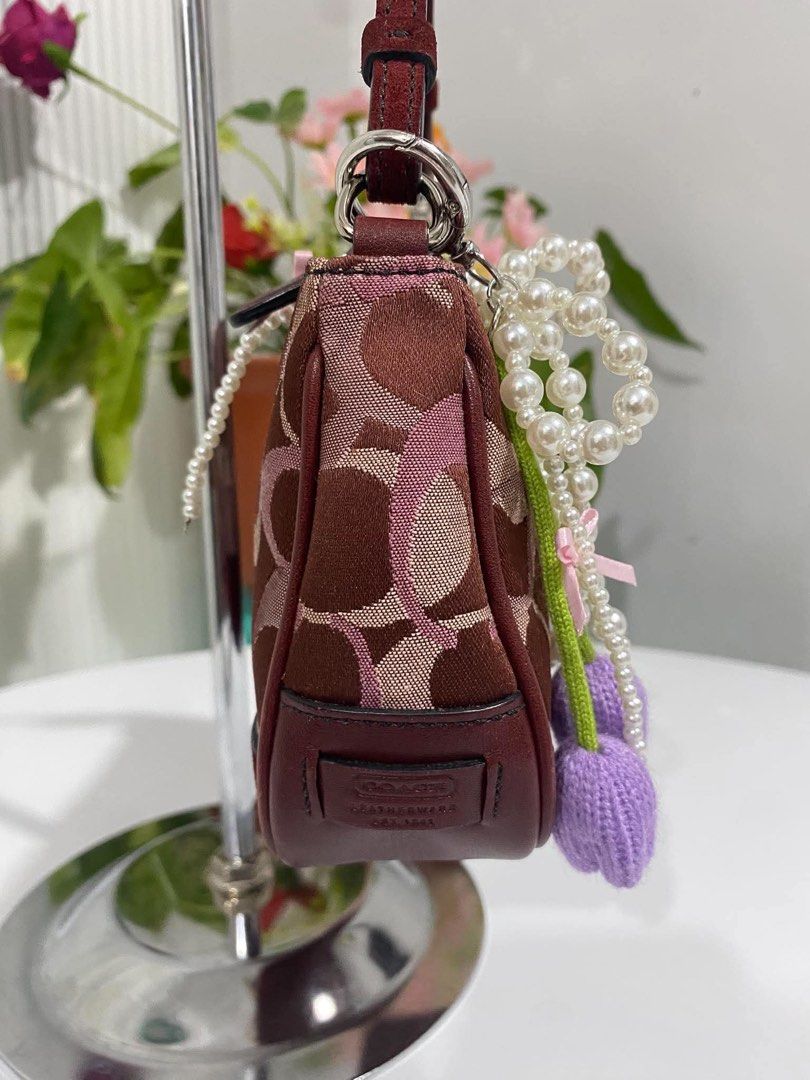 Coach Demi Burgundy Canvas/Suede (Category: Shoulder Bags) located in Cebu City. Submitted by gummybearsworld (Listing ID 1465594612, Image 3). Description: like new theres a little bleed on the handle please see photo can do bundle on my other bags dm me.