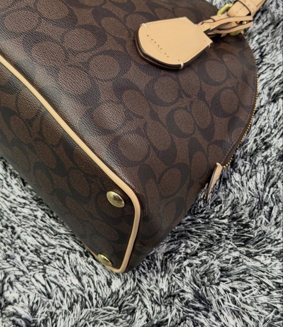 Coach Dome Bag (Category: Luxury Bags & Wallets) located in Quezon City. Submitted by declutteringcloset18 (Listing ID 1465584261, Image 2). Description: Barely used! With cards. No tears/rips. Retails ~20k+ .