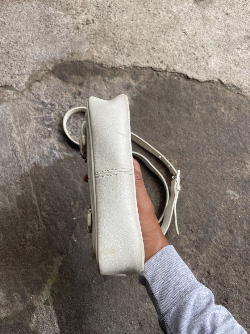Coach Leatherware Est. 1941 White Crossbody Bag (Category: Cross-body Bags) located in Polomolok. Submitted by madagascarts (Listing ID 1465608307, Image 3). Description: - Authentic Coach crossbody bag in classic off-white leather - Features a stylish front flap with dual buckle closures and an adjustable shoulder strap - Interior lined with fabric, featuring a secure zip pocket with reliable YKK hardware - Includes official creed patch (No. K30