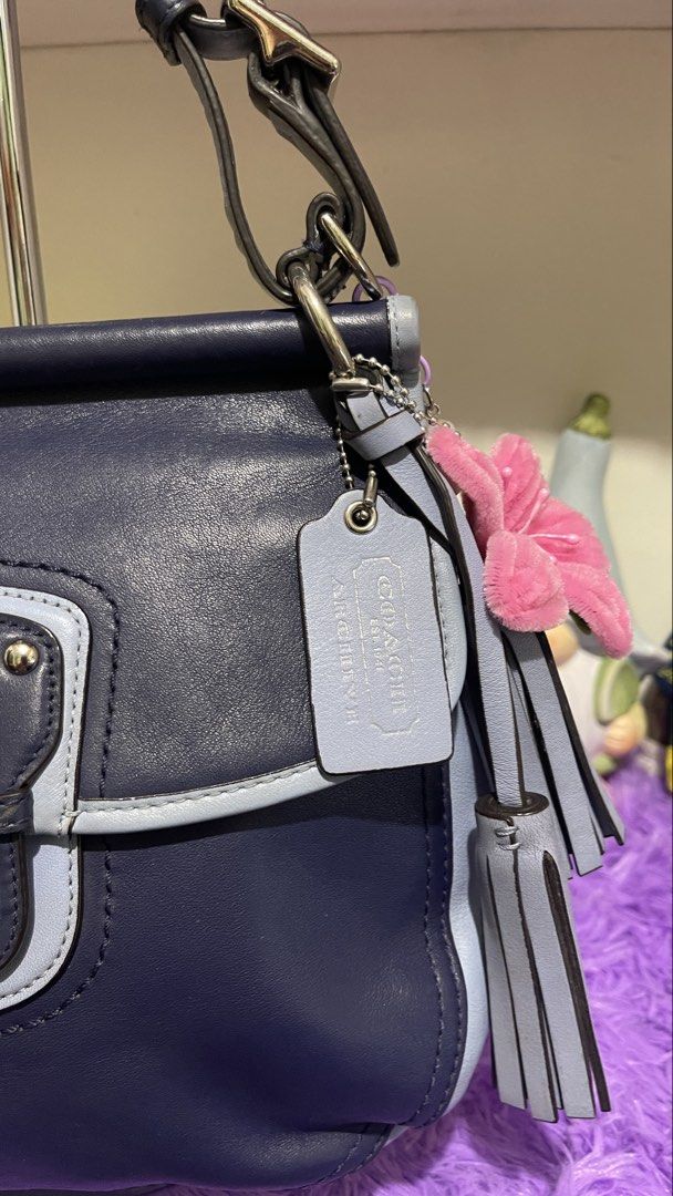 Coach Legacy Willis two tone (Category: Luxury Bags & Wallets) located in Manila. Submitted by just_loved (Listing ID 1465744682, Image 2). Description: - Authentic Coach shoulder bag in dark navy and light blue leather - Silver-tone hardware with adjustable top handles - Front flap pocket with secure twist-lock closure - Includes stylish leather hangtag and decorative side charms - Convenient back pocket featuring the stamped Coach logo - Clean,