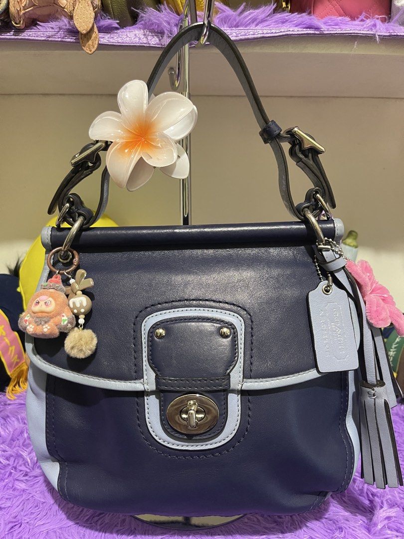 Coach Legacy Willis two tone (Category: Luxury Bags & Wallets) located in Manila. Submitted by just_loved (Listing ID 1465744682, Image 1). Description: - Authentic Coach shoulder bag in dark navy and light blue leather - Silver-tone hardware with adjustable top handles - Front flap pocket with secure twist-lock closure - Includes stylish leather hangtag and decorative side charms - Convenient back pocket featuring the stamped Coach logo - Clean,