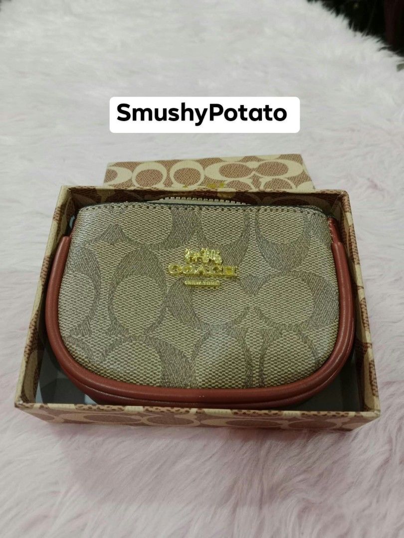 Coach Mini Crossbody Bag presented inside a signature Coach pattern box. (Category: Cross-body Bags) located in Taguig. Submitted by smushypotatoo2.0 (Listing ID 1465716846, Image 3). Description: Available in 4 designs & colors.
