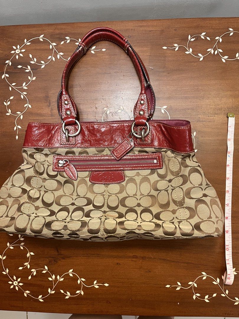 Coach Monogram Leather Tote Bag in Maroon (Category: Luxury Bags & Wallets) located in Manila. Submitted by lalalens._ (Listing ID 1465668667, Image 1). Description: classic brown monogram tote with maroon leather lining. slightly nego + SF !! love, love, love this classic bag. very spacious, handle just needs a little TLC. .