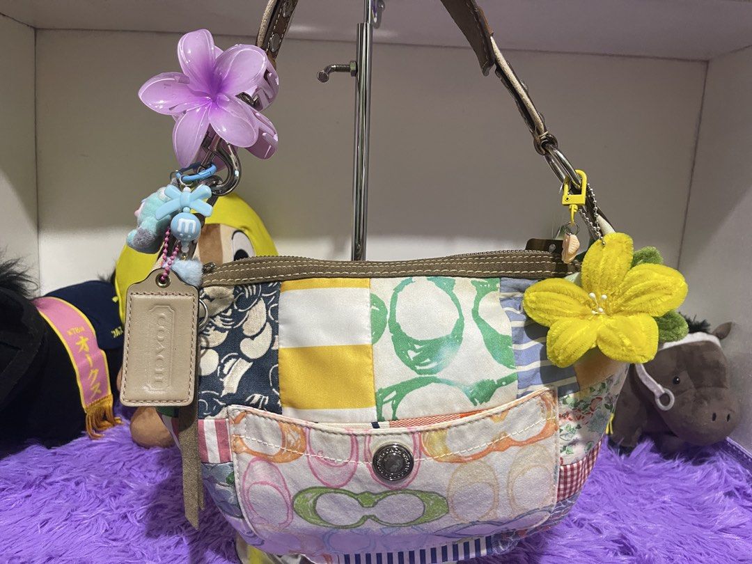 Coach Patchwork Handbag Y2K Multi-pattern Shoulder Bag (Category: Luxury Bags & Wallets) located in Manila. Submitted by just_loved (Listing ID 1465744095, Image 1). Description: - Authentic Coach patchwork shoulder bag - Unique mix of signature C print, stripes, florals, and gingham patterns - Front slip pocket with button snap closure and Coach hangtag - Comes with cute purple acrylic and yellow fabric flower charms - Secure zipper top closure 