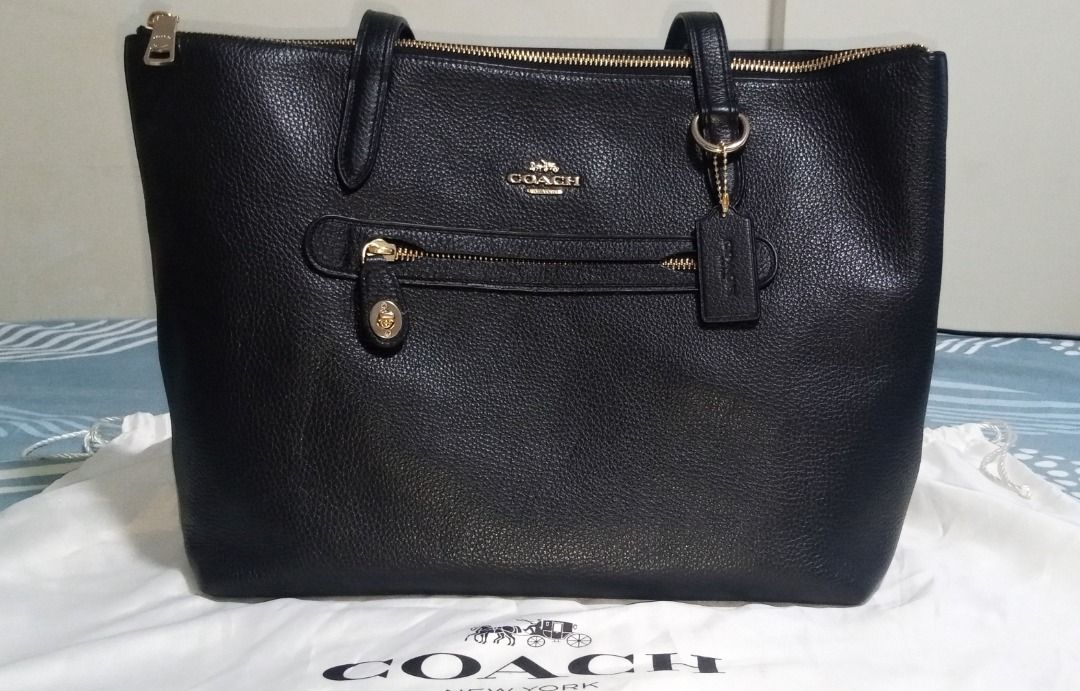 Coach Pebble Tote bag (Category: Luxury Bags & Wallets) located in Caloocan City. Submitted by gelee35 (Listing ID 1465589199, Image 3). Description: · ‎Colour: Black/ Gold · ‎Shoulder/ Tote/ Document Bag · ‎Calf Leather · ‎Coach Metallic Lettering Logo · ‎Front Exterior Zip Pocket with Classic Turnlock Closure · ‎Double Leather Shoulder Straps · ‎Top Zip Closure · ‎Gold-Toned Hardware · ‎1 Interior Zip Pocket; 2 Interior Slip Pockets · ‎Coach Si