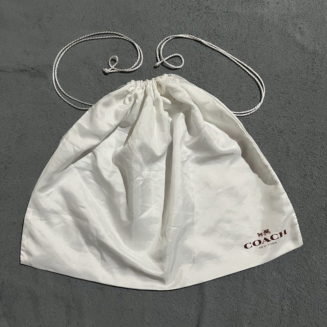 Coach Satin Dust Bag (Category: Luxury Bags & Wallets) located in Hagonoy. Submitted by ianthrift_ph (Listing ID 1465715172, Image 1). Description: (see detailed picture for size) pristine condition no holes issue: minor stain (washable) .