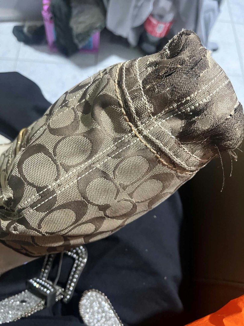 Coach Signature C Beige White Shoulder Bag (Category: Luxury Bags & Wallets) located in Quezon City. Submitted by darlenecamero_08 (Listing ID 1465625880, Image 2). Description: - Authentic Coach signature C jacquard fabric with white leather trim - Cream fabric interior lining with zipper top closure and creed patch (L0694-10402) - Noticeable wear and fraying at the bottom corner edge - Light marks on the white leather exterior panels - Affordab