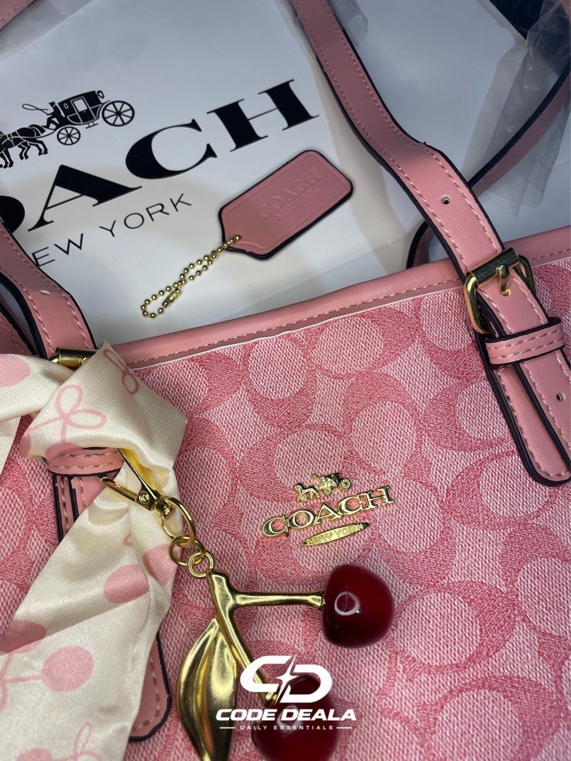 COACH SIGNATURE SHOULDER BAG | PINK (Category: Shoulder Bags) located in Manila. Submitted by codedeala. (Listing ID 1465605261, Image 3). Description: ✨ Brand: Coach 👜 Type: Shoulder Bag 🎀 Color: Pink 🌸 Pattern: Coach Signature Monogram 🍒 Details: Pink leather straps + cherry charm accent 📦Condition: Brand New / Never Used Comes with Coach packaging as shown Perfect for everyday use—spacious, feminine, and easy to pair with different outfit