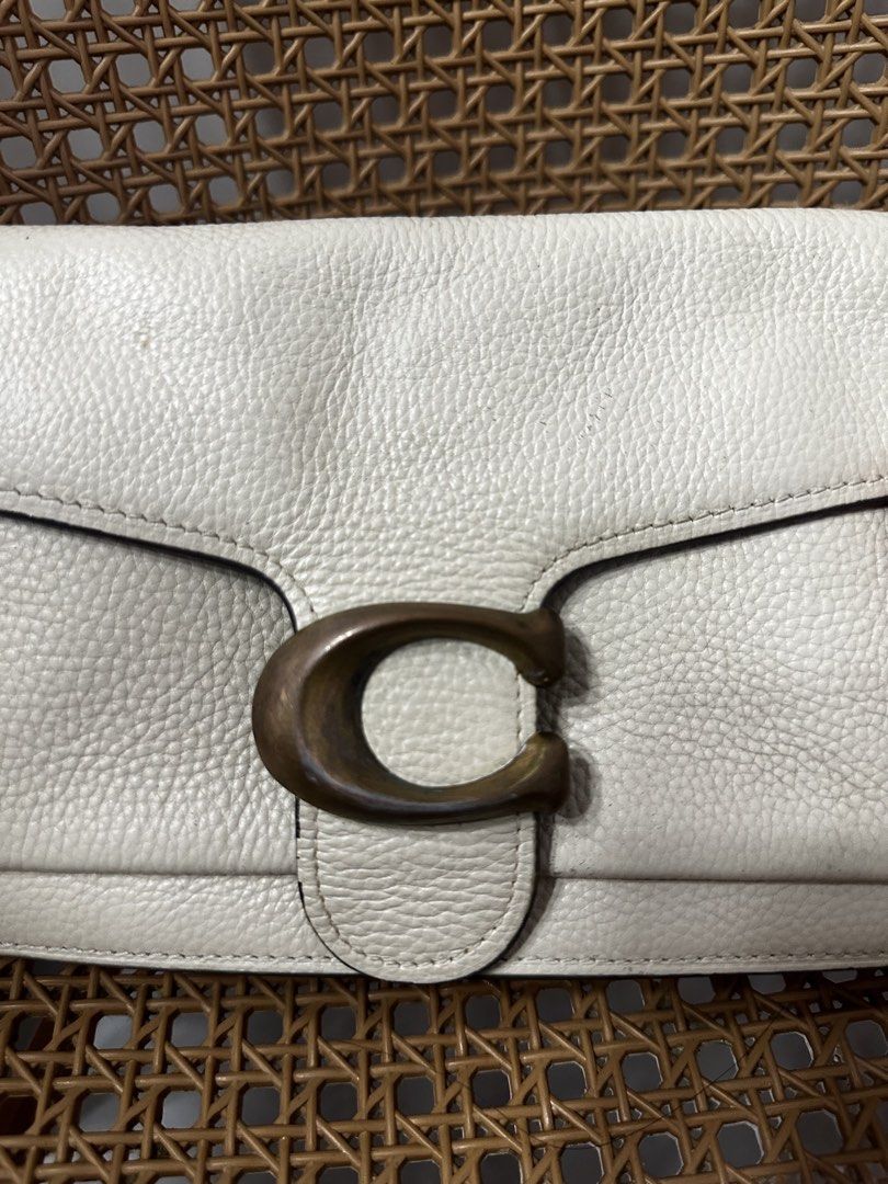 Coach Tabby Shoulder Bag White Leather (Category: Shoulder Bags) located in Tarlac. Submitted by wearagainboutique (Listing ID 1465661075, Image 2). Description: - Coach white leather shoulder bag - Features cream pebble leather, antiqued brass hardware, and signature C clasp - Stylish contrast mustard yellow suede lining under the front flap - Convenient rear slip pocket for quick storage - Includes a removable matching short shoulder strap - Co