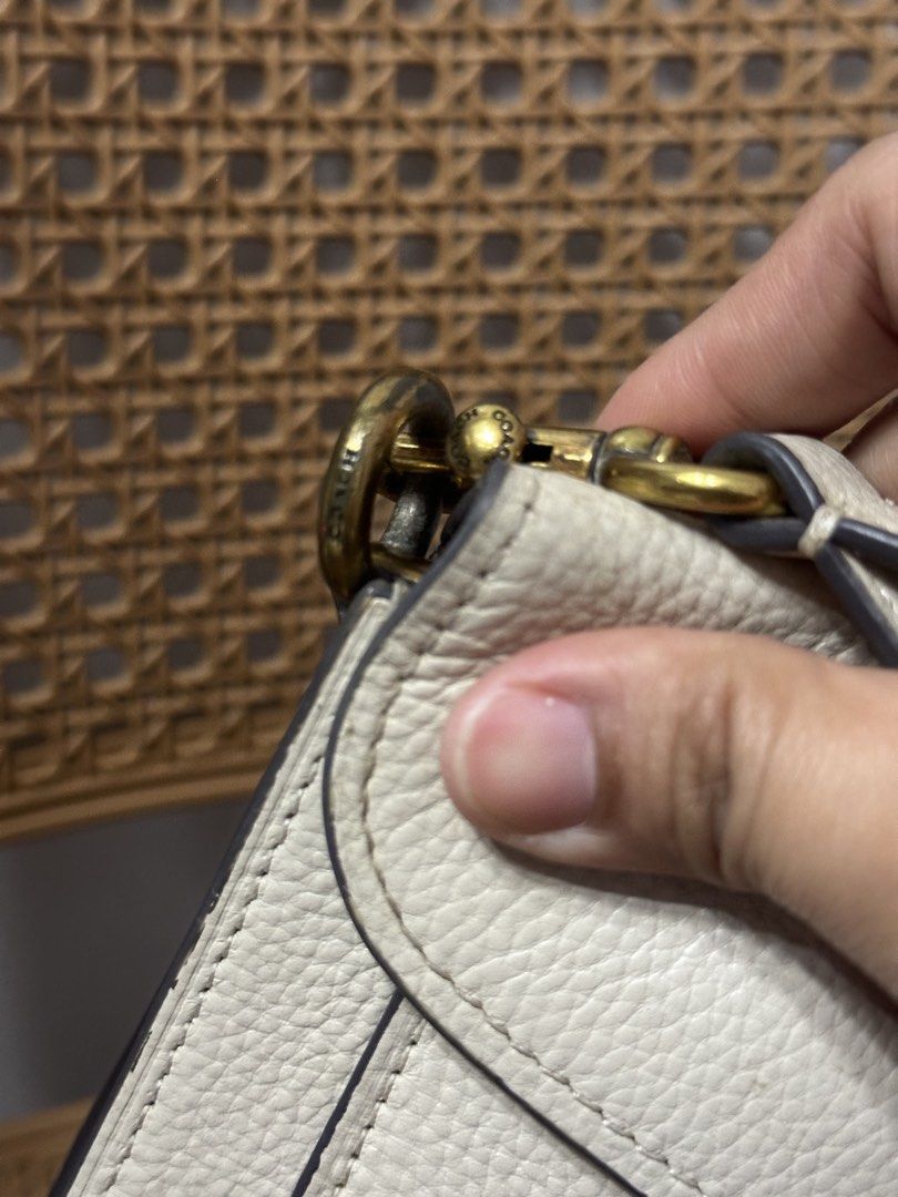 Coach Tabby Shoulder Bag White Leather (Category: Shoulder Bags) located in Tarlac. Submitted by wearagainboutique (Listing ID 1465661075, Image 3). Description: - Coach white leather shoulder bag - Features cream pebble leather, antiqued brass hardware, and signature C clasp - Stylish contrast mustard yellow suede lining under the front flap - Convenient rear slip pocket for quick storage - Includes a removable matching short shoulder strap - Co