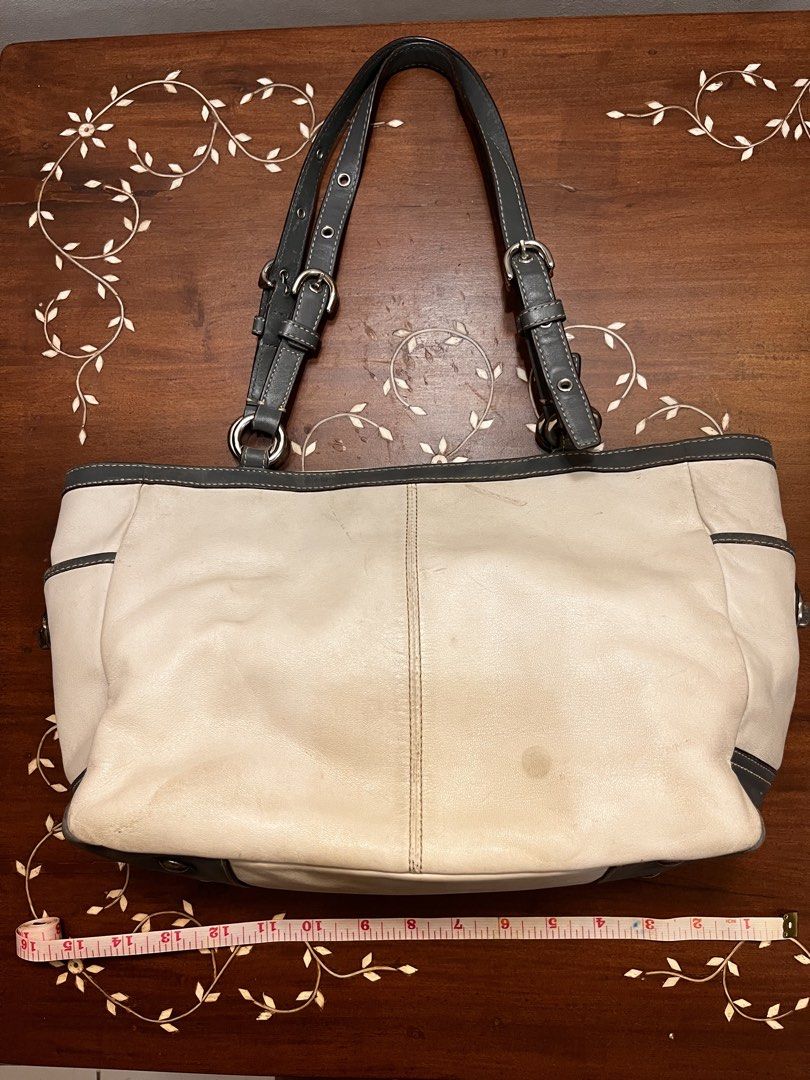 Coach White and Blue Leather Tote Bag (Category: Luxury Bags & Wallets) located in Manila. Submitted by lalalens._ (Listing ID 1465670749, Image 2). Description: coach white leather tote bag, with flaws! kindly check pics for the conditions. slightly nego + SF spacious light purple interior, with turn-lock side pockets. good condition of the handles, leather body just has stains .
