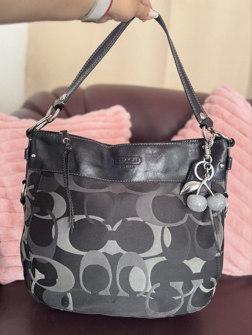 Coach Zoe Large in Black Optic 🖤 (Category: Tote Bags) located in San Francisco. Submitted by shopluckyfindsbydk (Listing ID 1465636987, Image 1). Description: - Lightly used - 100% authentic - signs of wear on rubber linings around the hardwares of bag - has hangtag - clean insides - has indentation but sa back part ng lips, di masyado halata since boack - bag is in perfect condition 🌸 All items are preloved. Please manage your expectations. R