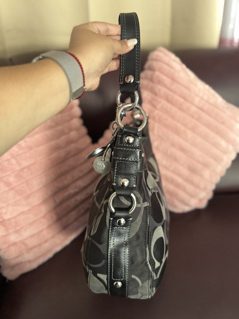 Coach Zoe Large in Black Optic 🖤 (Category: Tote Bags) located in San Francisco. Submitted by shopluckyfindsbydk (Listing ID 1465636987, Image 3). Description: - Lightly used - 100% authentic - signs of wear on rubber linings around the hardwares of bag - has hangtag - clean insides - has indentation but sa back part ng lips, di masyado halata since boack - bag is in perfect condition 🌸 All items are preloved. Please manage your expectations. R