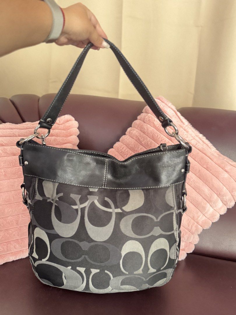 Coach Zoe Large in Black Optic 🖤 (Category: Tote Bags) located in San Francisco. Submitted by shopluckyfindsbydk (Listing ID 1465636987, Image 2). Description: - Lightly used - 100% authentic - signs of wear on rubber linings around the hardwares of bag - has hangtag - clean insides - has indentation but sa back part ng lips, di masyado halata since boack - bag is in perfect condition 🌸 All items are preloved. Please manage your expectations. R