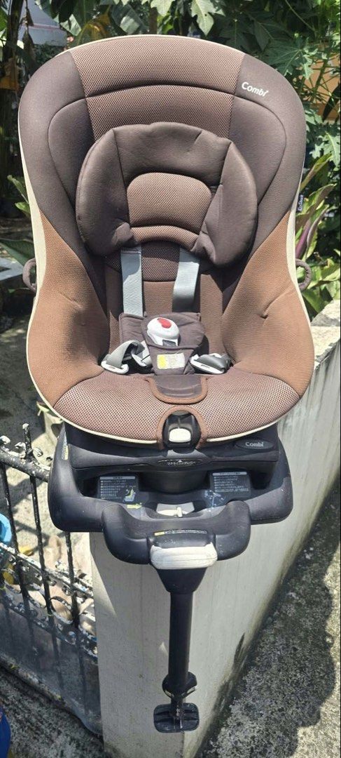 Combi Rotating Baby Car Seat with Support Leg (Category: Car Seats) located in Quezon City. Submitted by mjgaudier (Listing ID 1465684673, Image 1). Description: - Authentic Combi child car seat in stylish brown and beige tones - Convenient 360-degree rotating base with front adjustable recline lever - Secure built-in harness straps with easy central buckle release - Includes removable newborn headrest insert for younger babies - Equipped with a 