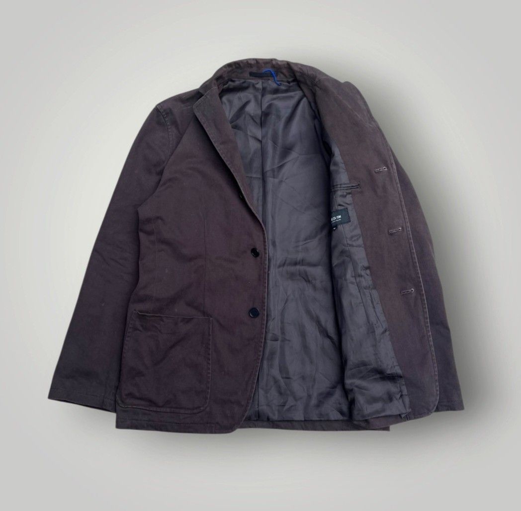 COMME CA ISM japan coat (Category: Activewear) located in Zamboanga. Submitted by sixthread (Listing ID 1465719153, Image 2). Description: This appears to be a tailored blazer or jacket from the Japanese fashion brand COMME CA ISM by Five Foxes Co. black brown color featuring an interior lining tag in a size M. Measurements: Lenght: 29 cm Width: 22 cm.