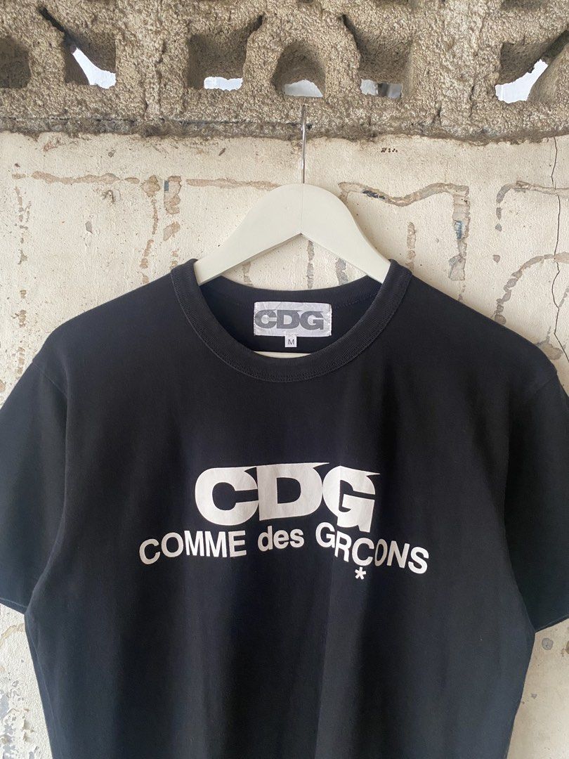 Comme des Garcons - White Logo Tee (Category: Tshirts & Polo Shirts ) located in Puerto Princesa. Submitted by something___. (Listing ID 1465670941, Image 3). Description: Comme des Garcons - White Logo Tee Tagged Size: Medium (Dimension) Length: 26 Width: 20.5 Condition: Excellent Color rate: 9.8 Flaws: None.