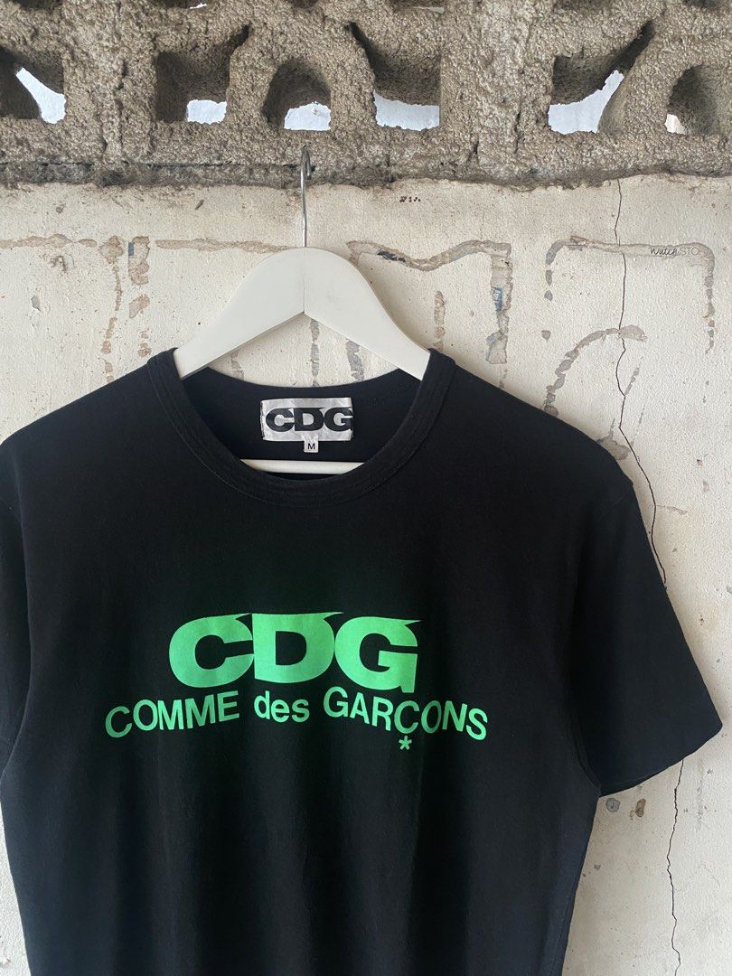 Comme des Garcons - Neon Green Script Logo Tee (Category: Tshirts & Polo Shirts ) located in Puerto Princesa. Submitted by something___. (Listing ID 1465671345, Image 3). Description: Comme des Garcons - Neon Green Script Logo Tee Tagged Size: Medium (Dimension) Length: 26.6 Width: 19.5 Condition: Excellent Color rate: 9.8 Flaws: None.