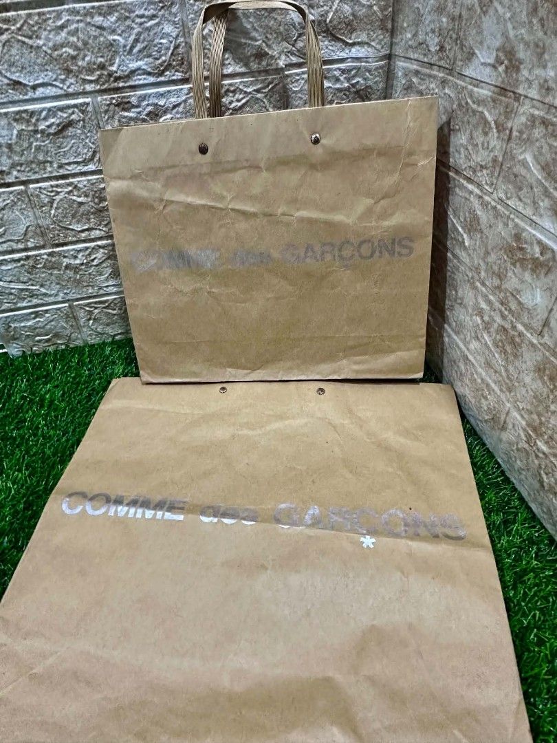 Comme des Garçons Authentic Paper Bag 🛍️ | Assorted Sizes (Category: Luxury Bags & Wallets) located in Antipolo. Submitted by saribymonica (Listing ID 1465613071, Image 1). Description: Comme des Garçons Authentic Paper Bag 🛍️ | Assorted Sizes | My Decluttering Authentic branded paper bag from my personal collection. 💕 Some were used once, while others are unused but have been stored for quite some time. • Assorted sizes • Some may have folds,