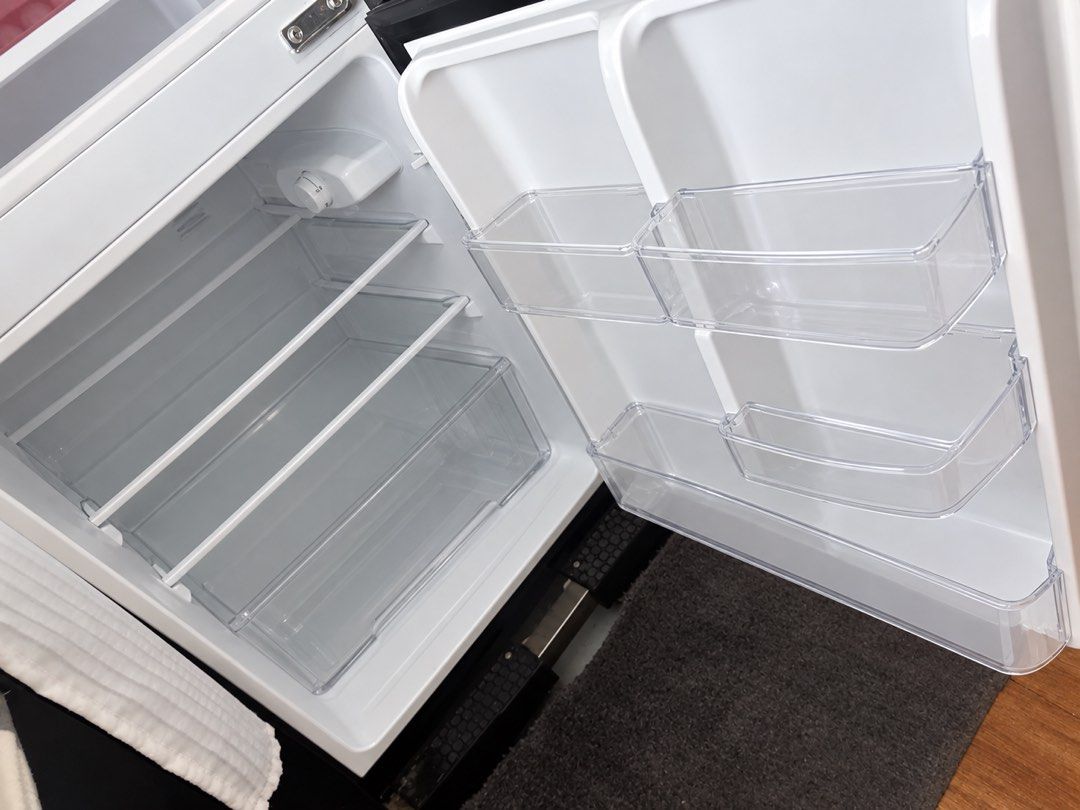 Compact Double Door Mini Fridge Black and White (Category: Refrigerators and Freezers) located in Mandaluyong City. Submitted by kusha23 (Listing ID 1465604815, Image 2). Description: - Compact double door fridge in stylish black and white - Top freezer compartment with inner door storage - Main fridge section with 3 adjustable glass shelves - Includes a fresh crisper drawer clear door bins - Easy-to-use internal temperature dial - Super clean in