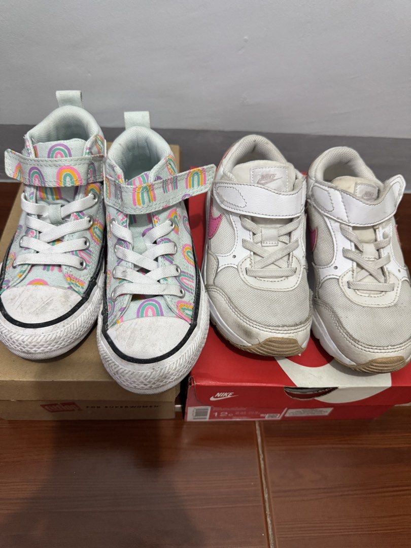 Converse & Nike Kids Shoes Bundle Size 11 & 12C (Category: Babies & Kids Fashion) located in Manila. Submitted by ivy110201 (Listing ID 1465665803, Image 1). Description: - Bundle includes 2 pairs of pre-loved kids shoes - Converse High Tops with colorful rainbow pattern (US Size 11) (used once) - Nike Air Max sneakers in white/pink with easy velcro strap (US Size 12C) - Ideal and durable option for everyday school or playground use.