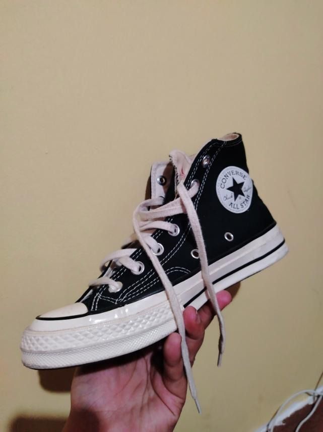 Converse Chuck 70 High Top Black (Category: Sneakers) located in Caloocan City. Submitted by marco.antor (Listing ID 1465686604, Image 3). Description: - Authentic black canvas Converse Chuck 70 high tops - Vintage-style cream midsoles with black foxing stripes and silver eyelets - Classic All Star ankle patch and heel license plate branding - Sturdy high foxing tape retro build - Condition: Normal wear on soles and midsoles, clean and ready to w