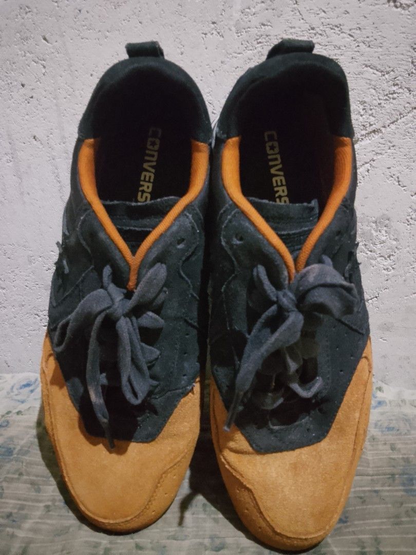 Converse Malden Racer Sneaker (Category: Dress Shoes) located in Manila. Submitted by wildwater26 (Listing ID 1465644390, Image 1). Description: - Brand: Converse low top sneakers - Material: Premium black and mustard brown suede upper - Design details: Contrasting orange collar lining, classic side star logo, and dark grey laces - Sole: Durable white midsole with dark outsole - Fit & Style: Comfortable everyday wear with a sleek runner-inspired 