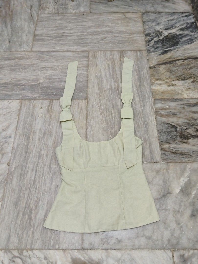 Coquette top (Category: Sleeveless) located in Mandaluyong City. Submitted by bravestone_7b1fa4 (Listing ID 1465706946, Image 1). Description: Discoloration.