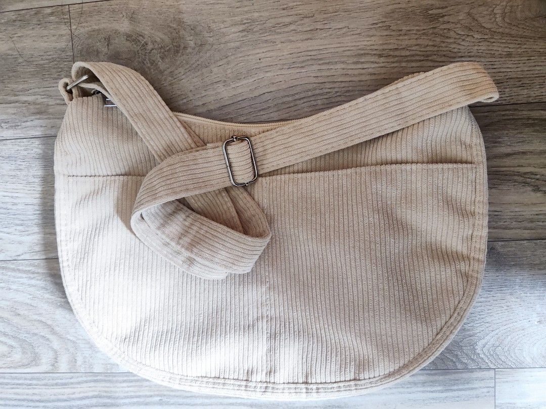 Corduroy Shoulder/Sling bag (Category: Shoulder Bags) located in Iligan City. Submitted by nadxxxie (Listing ID 1465708864, Image 2). Description: -Corduroy sling dumpling bag -Color: Beige -Cute, casual dumpling/slouchy shape -Adjustable sling strap -Spacious enough for everyday essentials.