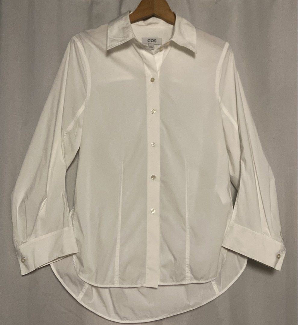 COS White Button-Up Tailored Polo Longsleeve (Category: Shirts) located in Caloocan City. Submitted by declutteringph. (Listing ID 1465697374, Image 2). Description: Size EUR32 on the tag! Measurements: Dimensions: (inches) Shoulder Width: 16” Bust Width: 18” Body Length: 27” | Back: 30 1/2” Sleeves Length: 22”.