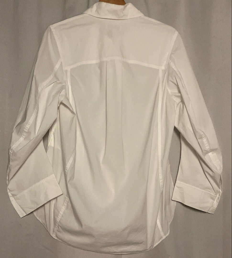 COS White Button-Up Tailored Polo Longsleeve (Category: Shirts) located in Caloocan City. Submitted by declutteringph. (Listing ID 1465697374, Image 3). Description: Size EUR32 on the tag! Measurements: Dimensions: (inches) Shoulder Width: 16” Bust Width: 18” Body Length: 27” | Back: 30 1/2” Sleeves Length: 22”.
