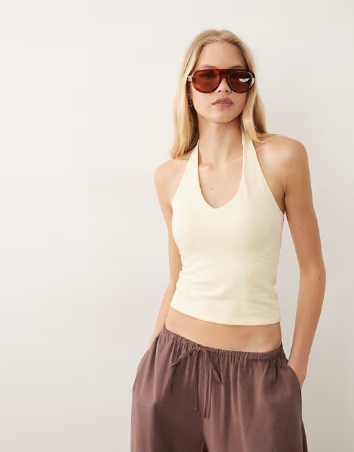 Cotton On Halter Top Yellow (Category: Sleeveless) located in Manila. Submitted by nadz.28 (Listing ID 1465742466, Image 1). Description: double lining stretchable sizes: xxs xs s m-l.