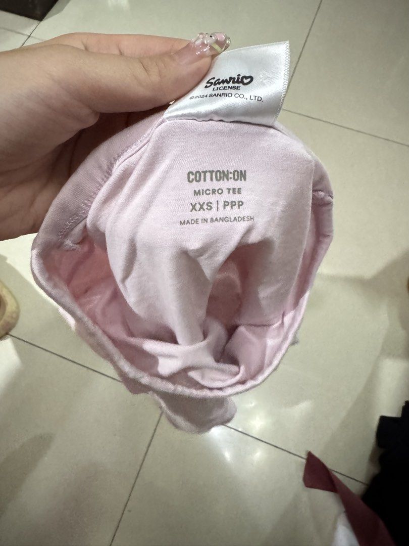 Cotton On Sanrio Hello Kitty Pink Micro Tee XXS (Category: Shirts) located in Quezon City. Submitted by sweetlyluxe (Listing ID 1465619178, Image 3). Description: - Brand: Cotton On (Official 2024 Sanrio Licensed Merch) - Style: Light pink micro tee with front Kitty graphic - Fit: XXS, tight and cropped - Material: Soft and stretchy cotton - Perfect for pairing with high-waisted jeans or skirts!.