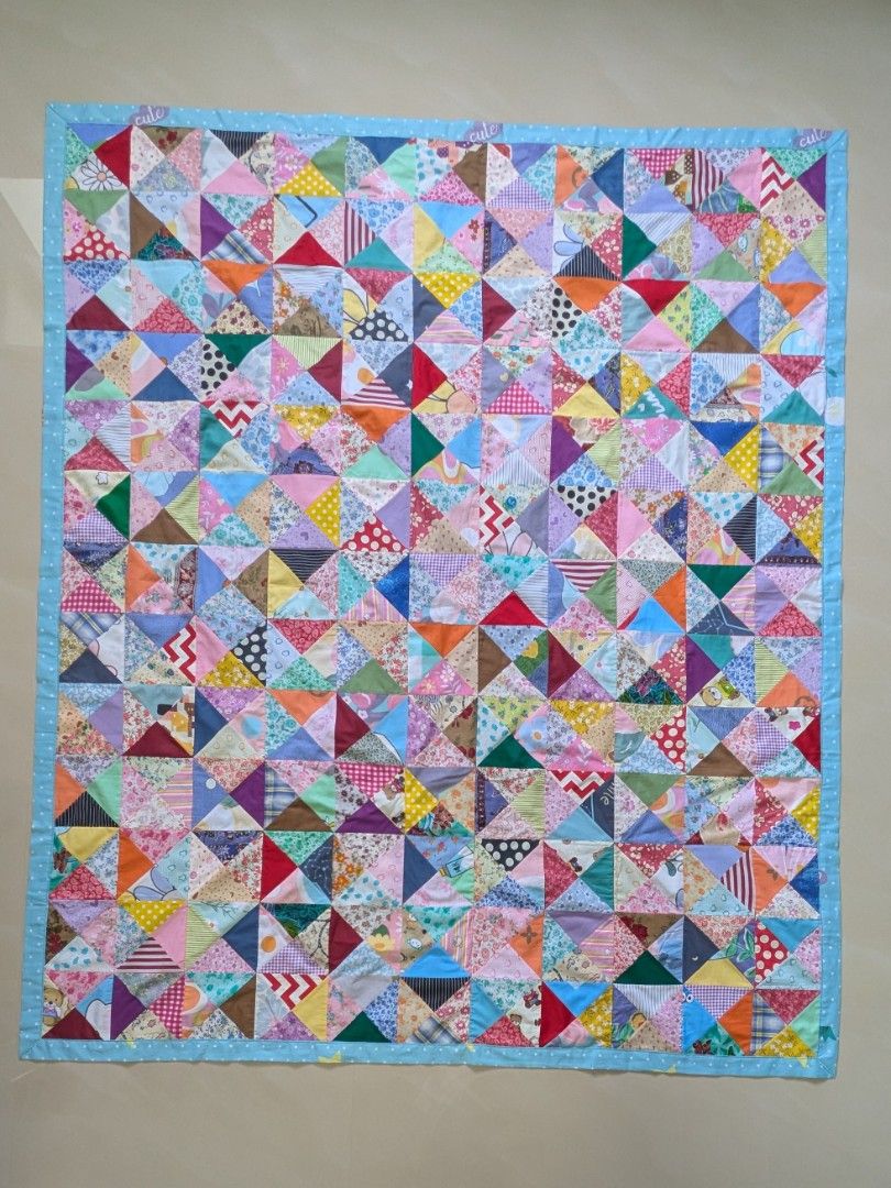 Cotton Patchwork Blanket (Category: Bedding & Towels) located in Singapore. Submitted by hiangneo (Listing ID 1465634642, Image 1). Description: Cotton patchwork blanket, patched with 1440 pcs of tiny triangular fabrics. Rabbit design with blue and polka dot cotton fabric backing. Fine workmanship. Adult size: 69" x 58.5" (179cm X 149cm). Cash on collection at Tiong Bahru MRT. .