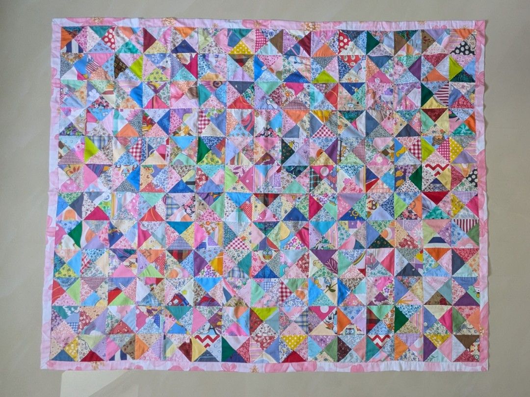 Cotton Patchwork Blanket (Category: Bedding & Towels) located in Singapore. Submitted by hiangneo (Listing ID 1465636342, Image 1). Description: Cotton patchwork blanket, patched with 720 pcs of tiny triangular fabrics. Sweet Pink floral cotton fabric backing. Fine workmanship. Adult size: 71" x 57" (180cm X 145cm). Cash on collection at Tiong Bahru MRT. Do view my other listings. .
