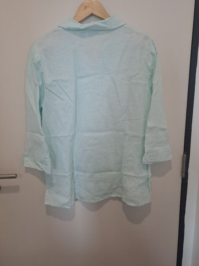COVINGTON 100% LINEN (Category: Longsleeves) located in Manila. Submitted by joanbalde39643 (Listing ID 1465605208, Image 3). Description: The image features a mint green, light pastel-colored linen button-up shirt featuring a wide spread collar, button-front closures, and relaxed 3/4 sleeves..