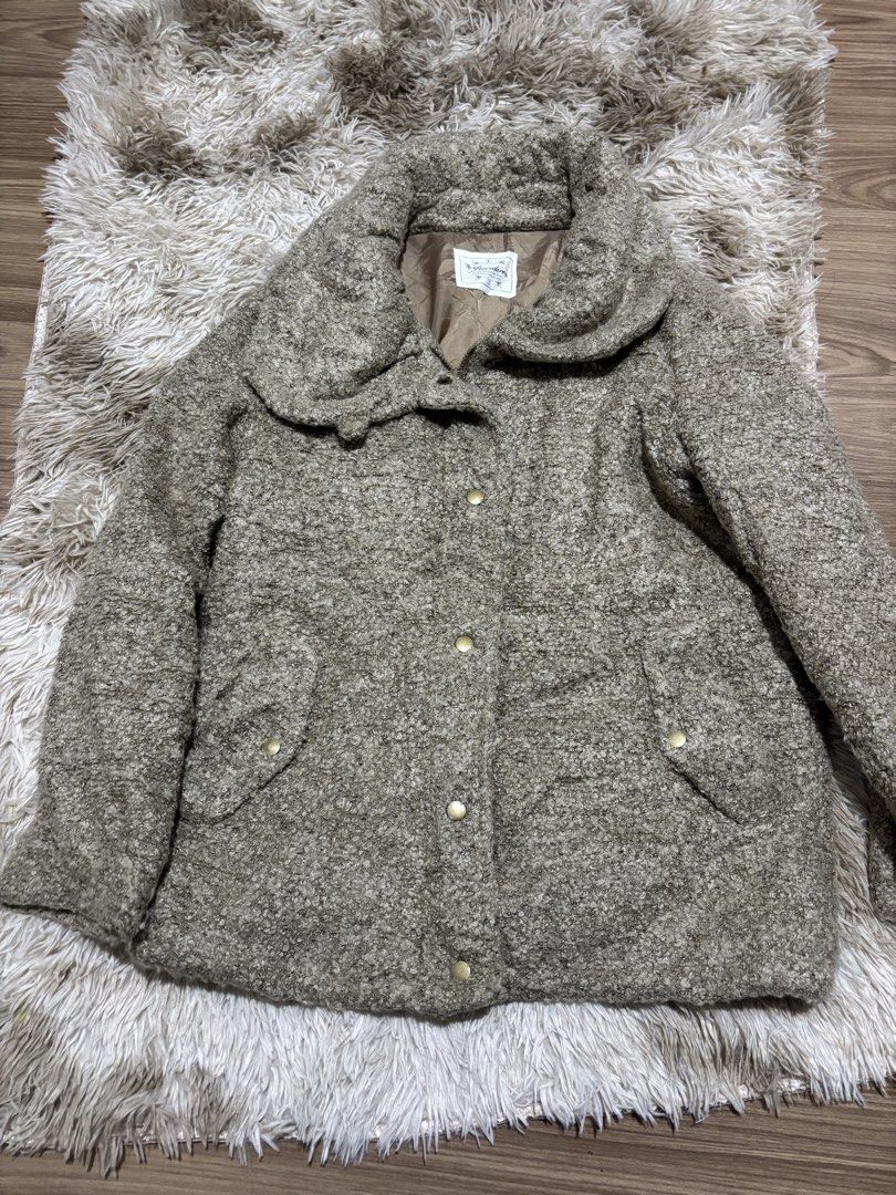 Cozy Brown Tweed Button-Up Winter Jacket (Category: Coats, Jackets and Outerwear) located in Makati City. Submitted by siopao014 (Listing ID 1465589020, Image 3). Description: - Style: Textured brown tweed jacket with warm lining - Collar: Big collar design to keep your neck warm - Closure: Easy snap buttons down the front - Pockets: Two deep side pockets for hands or small items - Material: Thick, soft, and perfect for cold days.