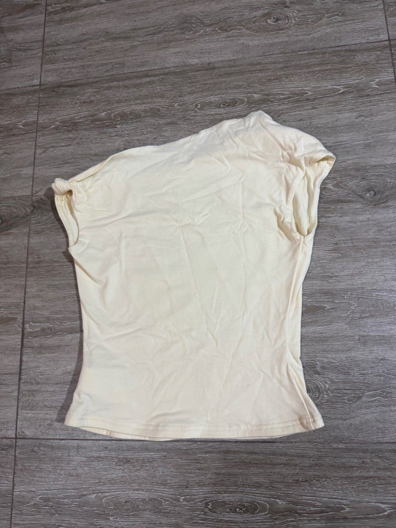 Cream asymmetrical top (Category: Others Tops) located in Quezon City. Submitted by thshxn21 (Listing ID 1465678941, Image 1). Description: ITEM DETAILS & SELLING TERMS * RFS: Not flattering on me * Fit Reference/Measurements: * Bust: 34” * Waist: 26” * Hips: 38” SHIPPING & PAYMENT * Delivery: Lalamove only (Buyer shoulders the shipping fee) * Payment via GCash / Bank Transfer PLEASE READ BEFORE BUYING * Pre-loved/Used unless stated otherwise. Pl