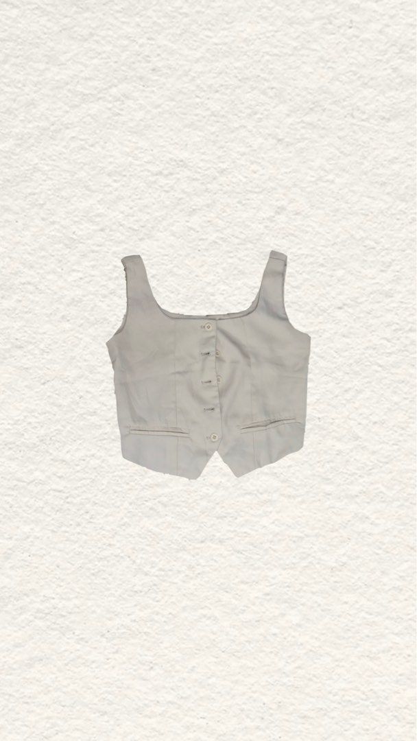 Cream Tailored Crop Vest with Front Buttons (Category: Sleeveless) located in Quezon City. Submitted by zealhorse_a9f3c3 (Listing ID 1465621102, Image 1). Description: - Color: Cream - Style: Cropped vest with a square neckline - Details: Button-up front with matching white buttons, two faux welt pockets, tailored front seams - Fit: Flattering tailored fit - Versatility: Great layering piece for casual or smart-casual outfits.