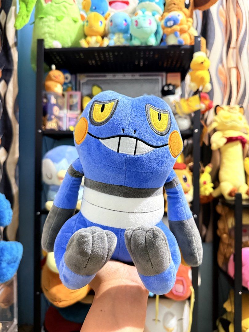Croagunk Pokémon Plush Toy (Category: Plushies & Soft Toys) located in Cavite. Submitted by projectplushie (Listing ID 1465675594, Image 1). Description: - Official Pokémon Croagunk plush toy in blue and grey - Made with ultra-soft fabric and neat embroidered facial features - Features a charming sitting pose with detailed hands, feet, and belly stripe - With pptag.