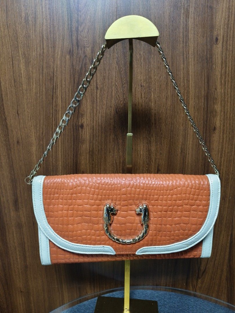 Croco Embossed Two-way Baguette/Clutch Bag (Category: Clutches) located in Baguio. Submitted by PreiLoveMaria (Listing ID 1465593894, Image 2). Description: Croco Embossed Two-way Baguette/Clutch Bag Featuring contrasting white trim details, a unique statement ring clasp with animal head accents on the front, and a versatile chain strap, it easily transforms from a classy clutch to an elegant shoulder bag. Perfect for dates, parties, or special e