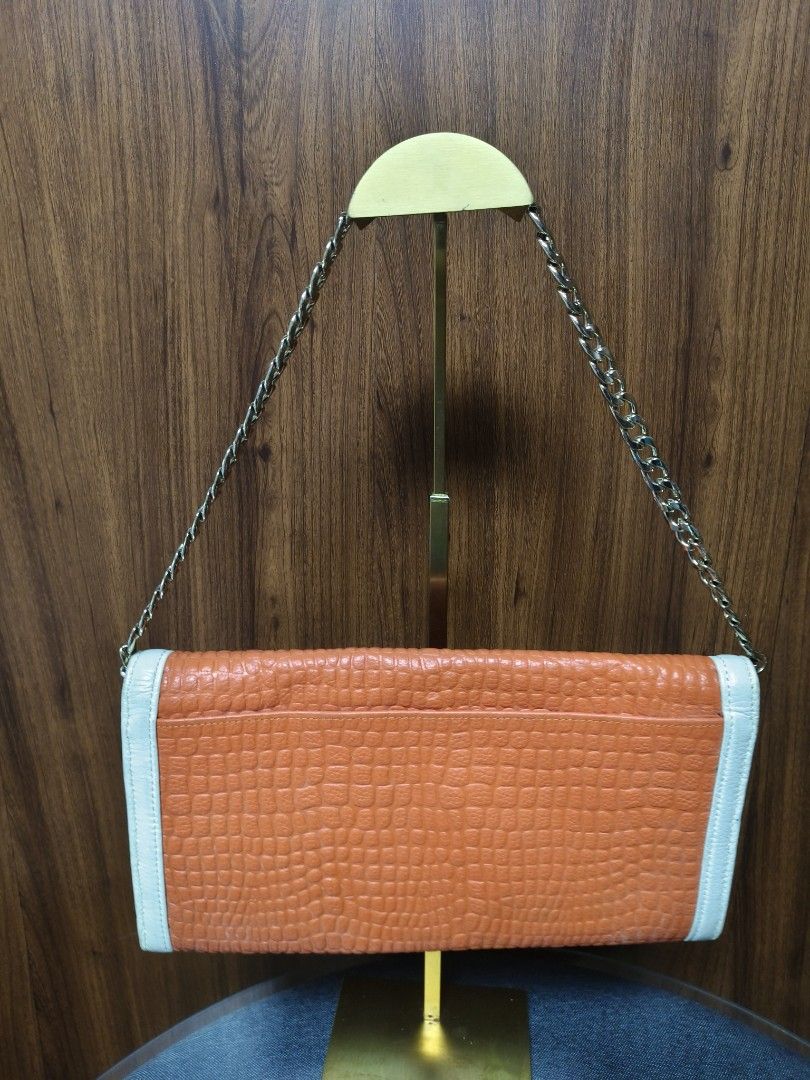 Croco Embossed Two-way Baguette/Clutch Bag (Category: Clutches) located in Baguio. Submitted by PreiLoveMaria (Listing ID 1465593894, Image 3). Description: Croco Embossed Two-way Baguette/Clutch Bag Featuring contrasting white trim details, a unique statement ring clasp with animal head accents on the front, and a versatile chain strap, it easily transforms from a classy clutch to an elegant shoulder bag. Perfect for dates, parties, or special e