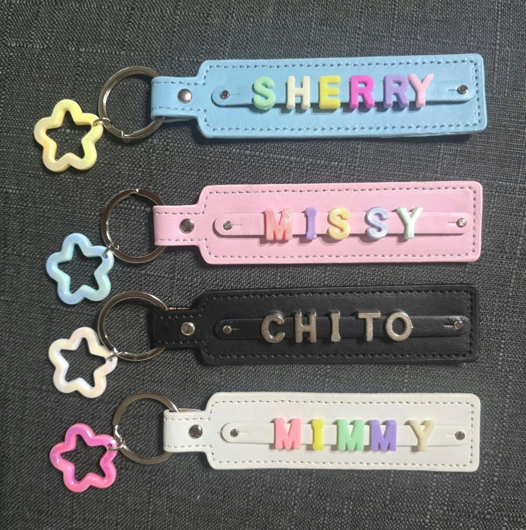Custom Name Faux Leather Keychains with Star Charm (Category: Charms) located in Zaragoza. Submitted by sherree1281 (Listing ID 1465703547, Image 1). Description: - Set of 4 pastel faux leather keychains - Personalized names included: SHERRY, MISSY, CHITO, and MIMMY - Colorful letter beads secured by a central metal strip - Features clean edge stitching and durable metal rivets - Equipped with a sturdy split ring and a cute star-shaped charm - Ve