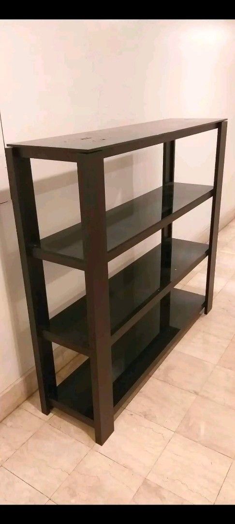 Dark brown wooden 4-tier open display shelf bookshelf (Category: Shelves, Cabinets & Racks) located in Taguig. Submitted by thrifthub.ph (Listing ID 1465667607, Image 1). Description: Condo Pull-out!! 4 tier Dark brown wood with glass on top each layer.Has minor issue,d naman halata.malaki po ito at makapal yung mga glass nya. Pwede pa pick up sa lalamove,if No time pumonta sa house. Loc.Central signal,Taguig city.
