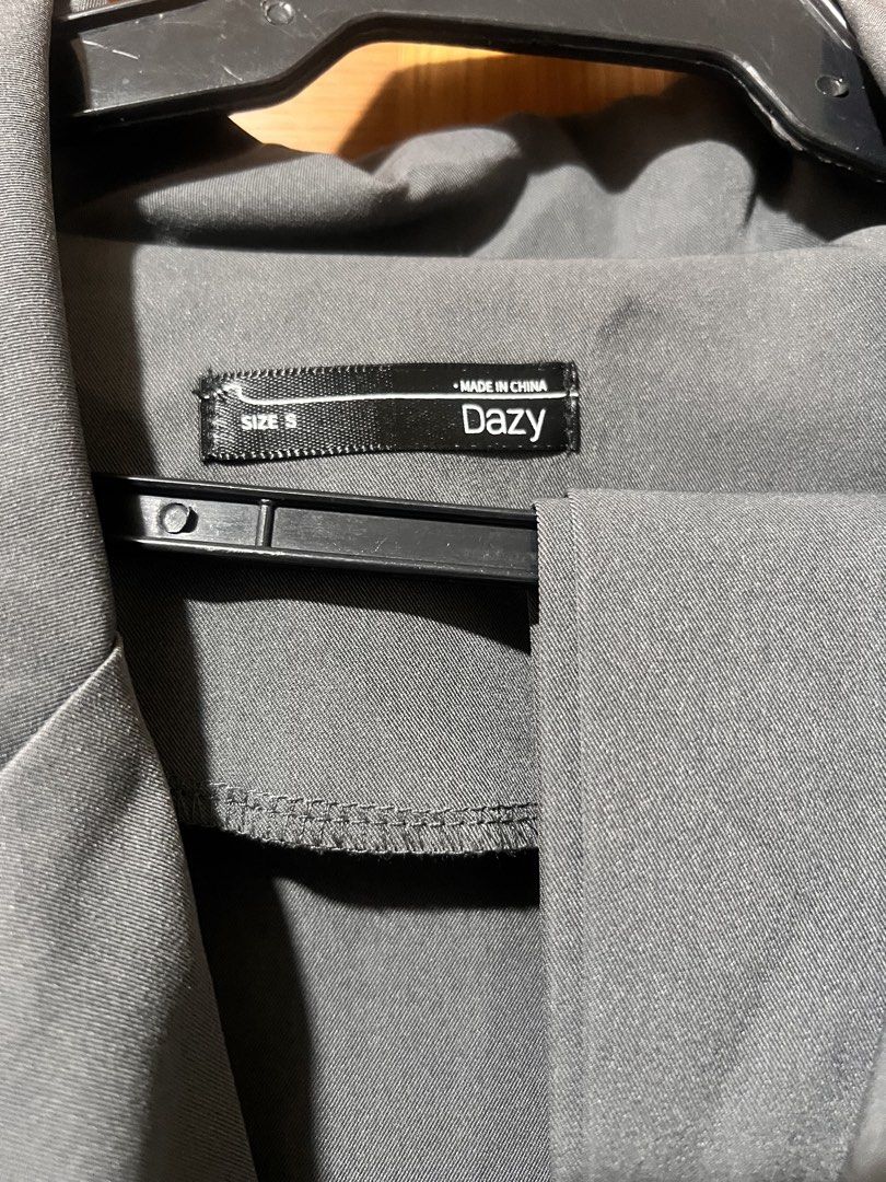 Dazy Grey Double-Breasted Trench Jacket Size S (Category: Coats, Jackets and Outerwear) located in Manila. Submitted by cheddarph (Listing ID 1465718612, Image 2). Description: - Brand: Dazy - Size: Small - Color: Grey - Style: Double-breasted with large lapels and stylish shoulder cape overlays - Features: Two functional front pockets - Fabric: Lightweight, ideal for layering during spring or autumn - Condition: Excellent pre-loved condition - M
