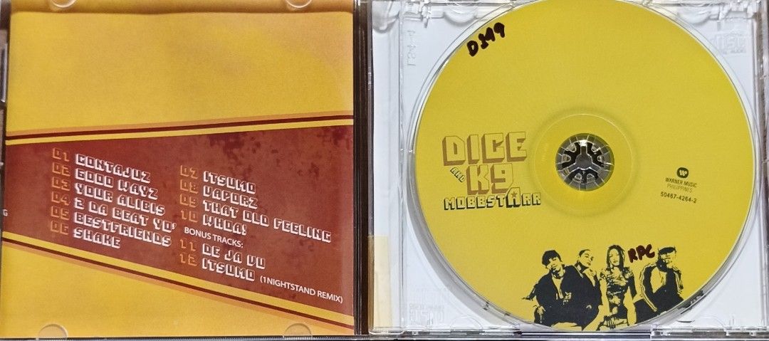 Dice and K9 Mobbstarr CD Album (Category: CDs & DVDs) located in Manila. Submitted by ruelcabrer77078 (Listing ID 1465640736, Image 3). Description: - Artist: Dice and K9 Mobbstarr - Album: Original 2004 release by Warner Music Philippines - Tracklist: 12 tracks including Contajuz, Good Wayz, Itsumo, and bonus tracks - Packaging: Jewel case with original artwork inserts - Disc: Original yellow disc - Details: Features back cover barcode and Warne