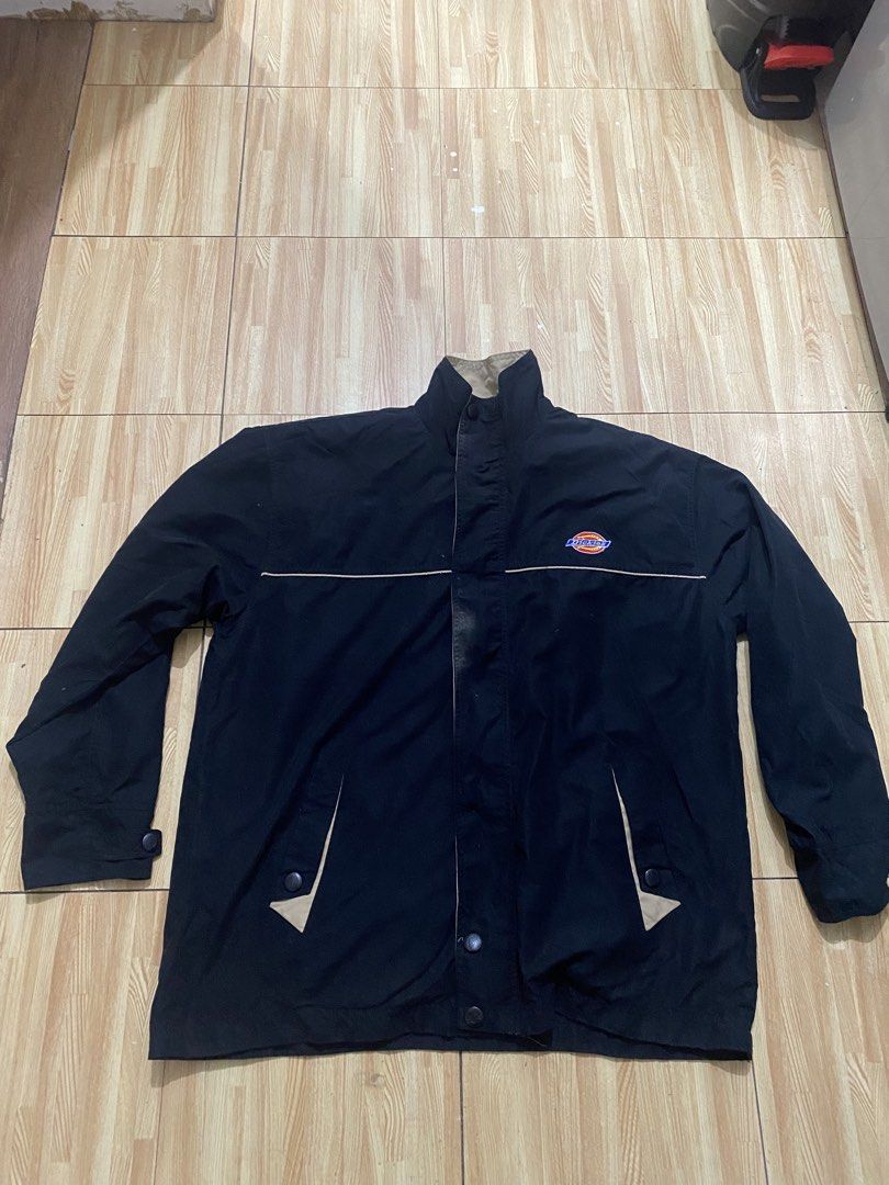 Dickies black reversible jacket (khaki underneath) (Category: Coats, Jackets and Outerwear) located in Manila. Submitted by tonialalelilolu (Listing ID 1465683159, Image 2). Description: - Brand: Dickies - Color: Black with khaki piping and collar lining - Details: Embroidered Dickies logo on the left chest - Pockets: Two angled front pockets with snap buttons - Closures: Snap button front placket and cuffs - Style: Versatile streetwear, perfect 