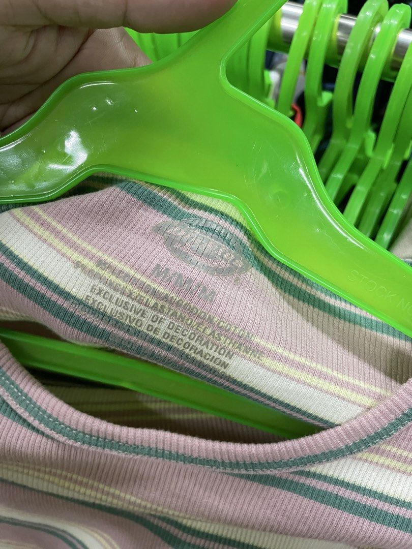 Dickies Striped Crop Top M (Category: Shirts) located in Lucena. Submitted by riyizthriftz (Listing ID 1465704180, Image 2). Description: - Brand: Dickies - Item: Ribbed crop top - Color/Pattern: Pink base with green, white, and yellow horizontal stripes - Size: M (printed inside collar) - Material: Cotton and elastane blend (lightweight with plenty of stretch) - Details: Short sleeves, lettuce hem trim, and small embroidered chest logo - Fit: Ca