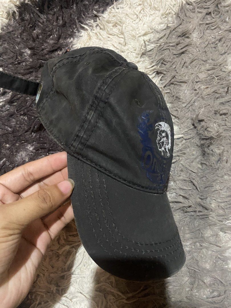 Diesel 1978 Mohican Logo Black Cap (Category: Caps & Hats) located in Caloocan City. Submitted by remythrift (Listing ID 1465628742, Image 2). Description: - Brand: Diesel - Color: Washed black - Material: Cotton twill with natural vintage fading - Design: Large mohawk graphic print and embroidered "1978" details upfront - Closure: Adjustable back strap with Diesel-stamped metallic buckle - Condition: Pre-loved with minor hardware oxidation and g