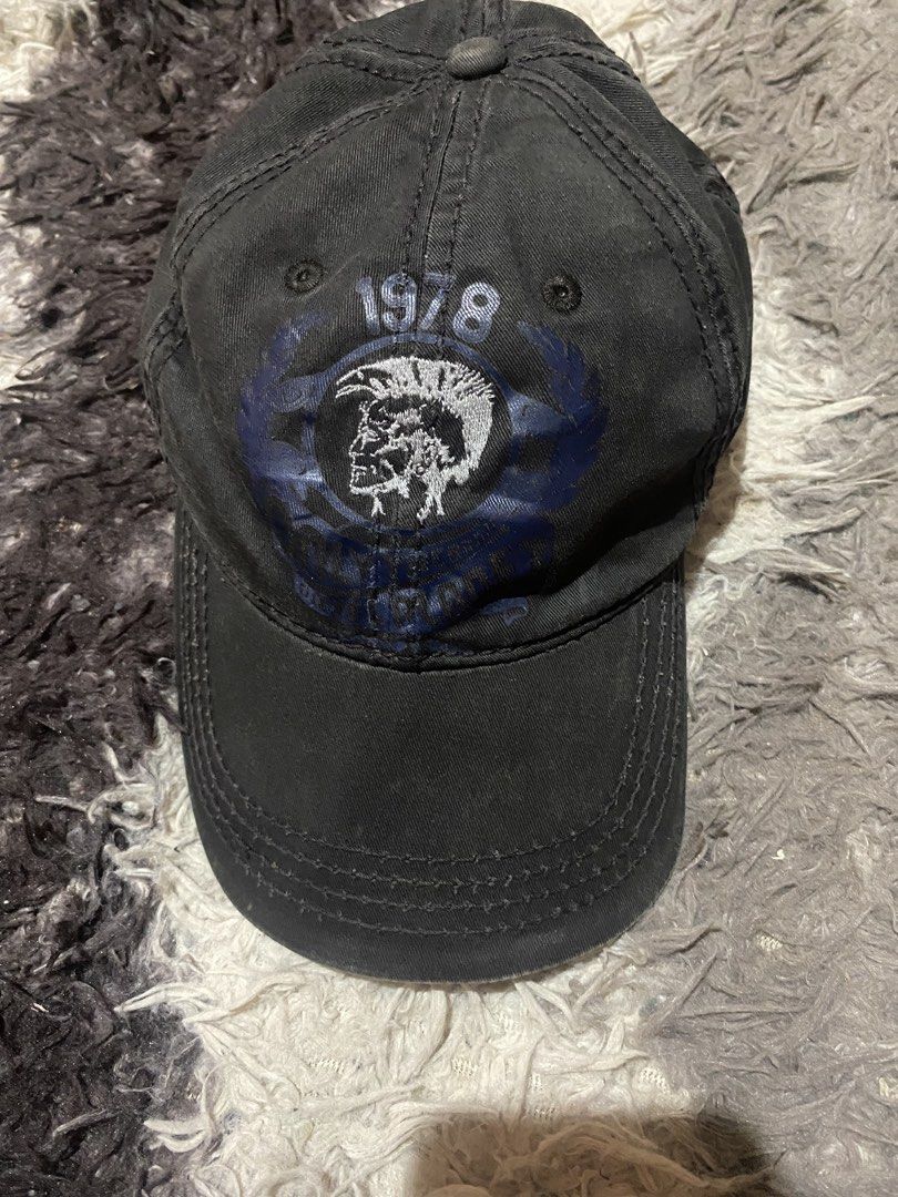 Diesel 1978 Mohican Logo Black Cap (Category: Caps & Hats) located in Caloocan City. Submitted by remythrift (Listing ID 1465628742, Image 1). Description: - Brand: Diesel - Color: Washed black - Material: Cotton twill with natural vintage fading - Design: Large mohawk graphic print and embroidered "1978" details upfront - Closure: Adjustable back strap with Diesel-stamped metallic buckle - Condition: Pre-loved with minor hardware oxidation and g